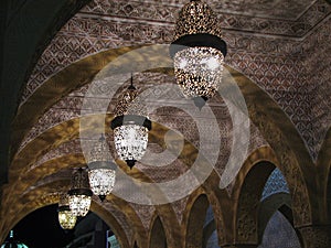Oriental Arabic lamps hanging under the roof.