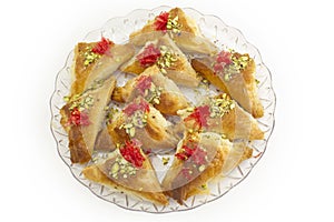 Oriental Arabic sweet warbat with qishta, kadayif, kunafa, with pistachio and cheese