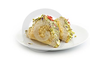 Oriental Arabic sweet warbat with qishta, kadayif, kunafa, with pistachio and cheese