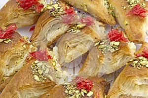 Oriental Arabic sweet warbat with qishta, kadayif, kunafa, with pistachio and cheese photo