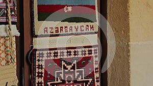 Oriental carpet with the image of the flag of Azerbaijan. The old city of Baku