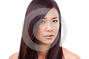 Oriental charm. a beautiful young oriental woman against a white background.