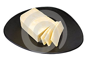Oriental cuisine, paneer indian white unsalted cheese on dark ceramic dish, isolated on white whithout shadow
