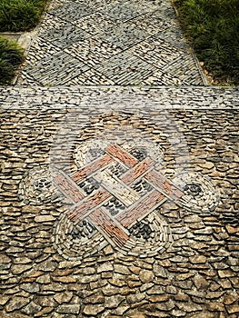 Oriental foot path tiles design in ancient Chinese garden