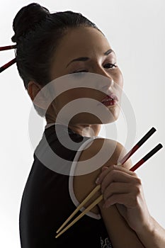 Oriental girl with chopstick