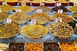 Oriental market stall with nuts and dried fruit.
