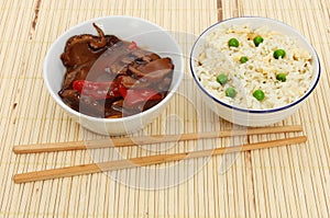 Oriental meal on bamboo matt photo