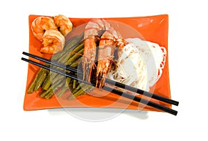 Oriental meal on orange plate