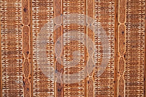 oriental pattern Uzbek traditional ornament on wooden carved ceiling in Tashkent in Uzbekistan