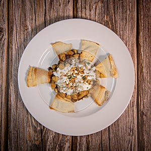 Oriental recipe aubergine and chickpea fatteh, pita, Greek yogurt, roasted pine nuts, zaatar