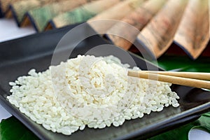 Oriental set of rice, chopsticks and transp