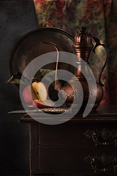 Oriental stilllife with copper jug kumgan and apple photo