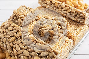 Oriental sweetness of brittle, Kozinaki in sugar glazed peanuts, sunflower seeds and sesame seeds