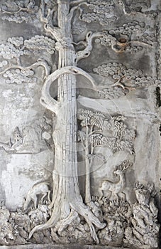 Oriental tree basrelief on wall