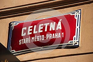 Orientation signs in Prague city, red street sign with white text: Celetna street, Old Town, Prague 1.