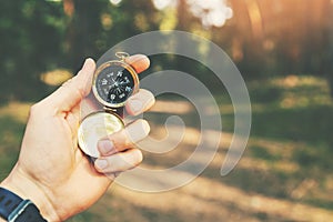 Orienteering in the woods compass in the hand