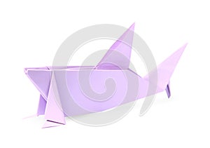 Origami art. Handmade lilac paper shark isolated on white
