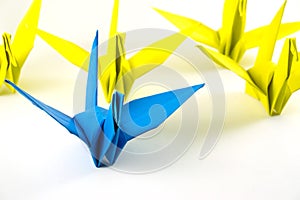 Origami birds demonstrate think different concept.