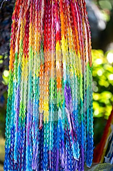 Origami - colorful paper crane chains folded by hand of students laid down in Peace Park Nagasaki, Japan