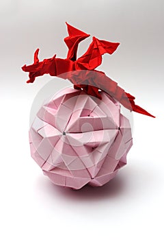 Origami dragon on paper ball