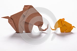 Origami elephant family in white background