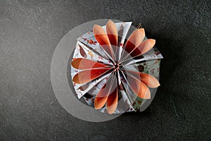 Origami Flower Blossom - Paper Art on Textured Background