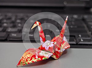 Origami on laptop photo