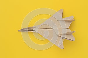 Origami paper airplane mockup. Selective focus. Bright yellow