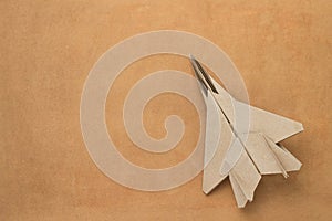 Origami paper airplane mockup. Selective focus. Old vintage craft