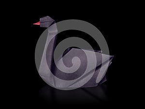 Origami paper rare event black swan on a black