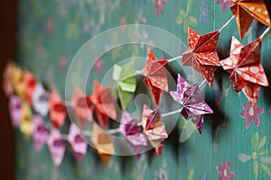 origami paper star garland against a wall