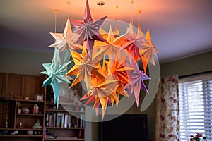 origami star mobile hanging from the ceiling