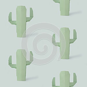 Origami succulent cactus plant on a mint blue background pattern