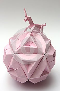 Origami unicorn riding paper ball