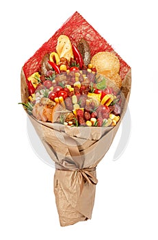 Original bouquet consisting of different varieties of sausage, meat, smoked cheese, tomatoes, pepper and bread as a gift