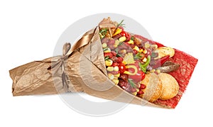 Original bouquet consisting of different varieties of sausage, meat, smoked cheese, tomatoes, pepper and bread as a gift on the wh