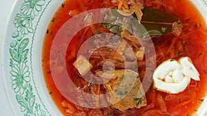 Original cabbage soup in a plate, top view