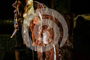 Original Caribbean food on the roadside in the Dominican Republic. Smoked pork, morcillas and longanizas.