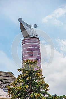 Original chimneys of an old brewery against the blue sky. The old building of the brewery in the city of Nitra, Slovakia