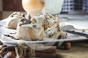 Original cinnabon rolls with chocolate-cream sauce and hazelnuts