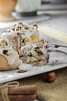 Original cinnabon rolls with chocolate-cream sauce and hazelnuts