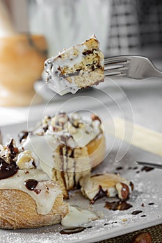 Original cinnabon rolls with chocolate-cream sauce and hazelnuts