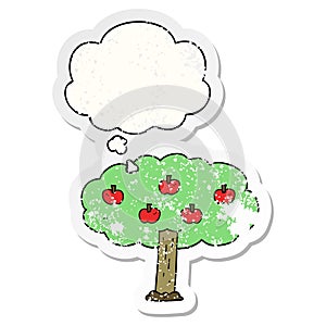 A creative cartoon apple tree and thought bubble as a distressed worn sticker