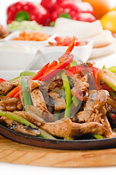 Original fajita sizzling hot on iron plate