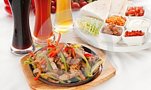 Original fajita sizzling hot on iron plate