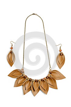 Original handicraft necklace and earrings in the form of petals made of brown leather on white background