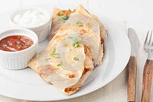 Original mexican quesadilla on white plate