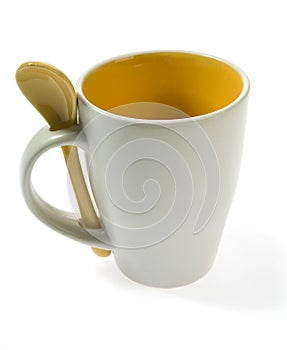 Original mug with spoon isolated on white photo