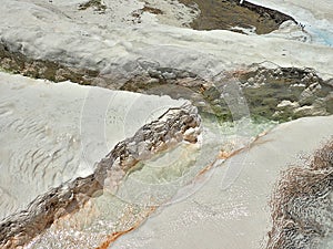 Original Pamukkale place in Turkey in Asia landscape with limestone pools with blue warm water