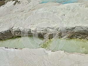 Original Pamukkale place in Turkey in Asia landscape with limestone pools with blue warm water